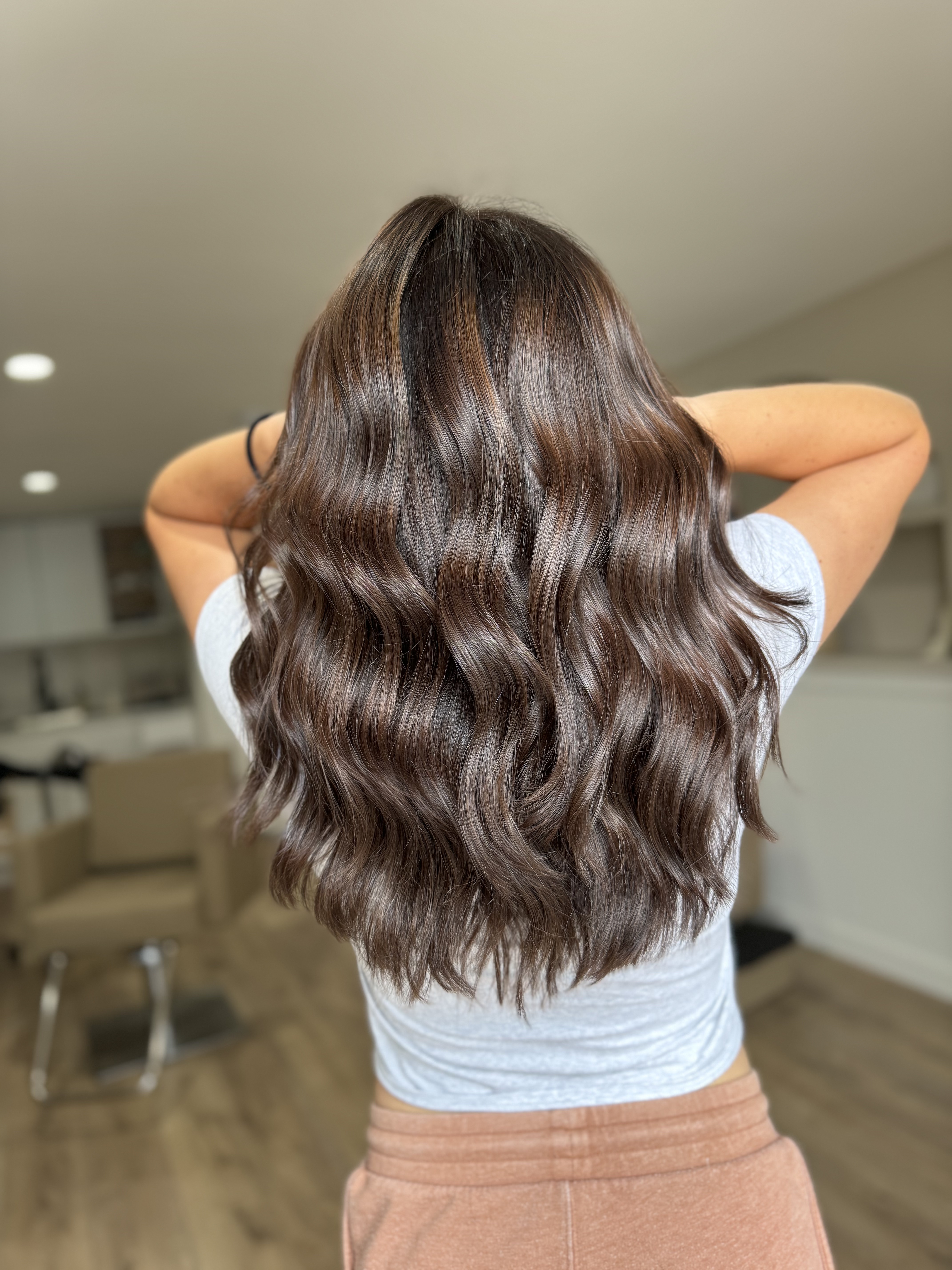 Glossy brunette hair by Veil & Vogue