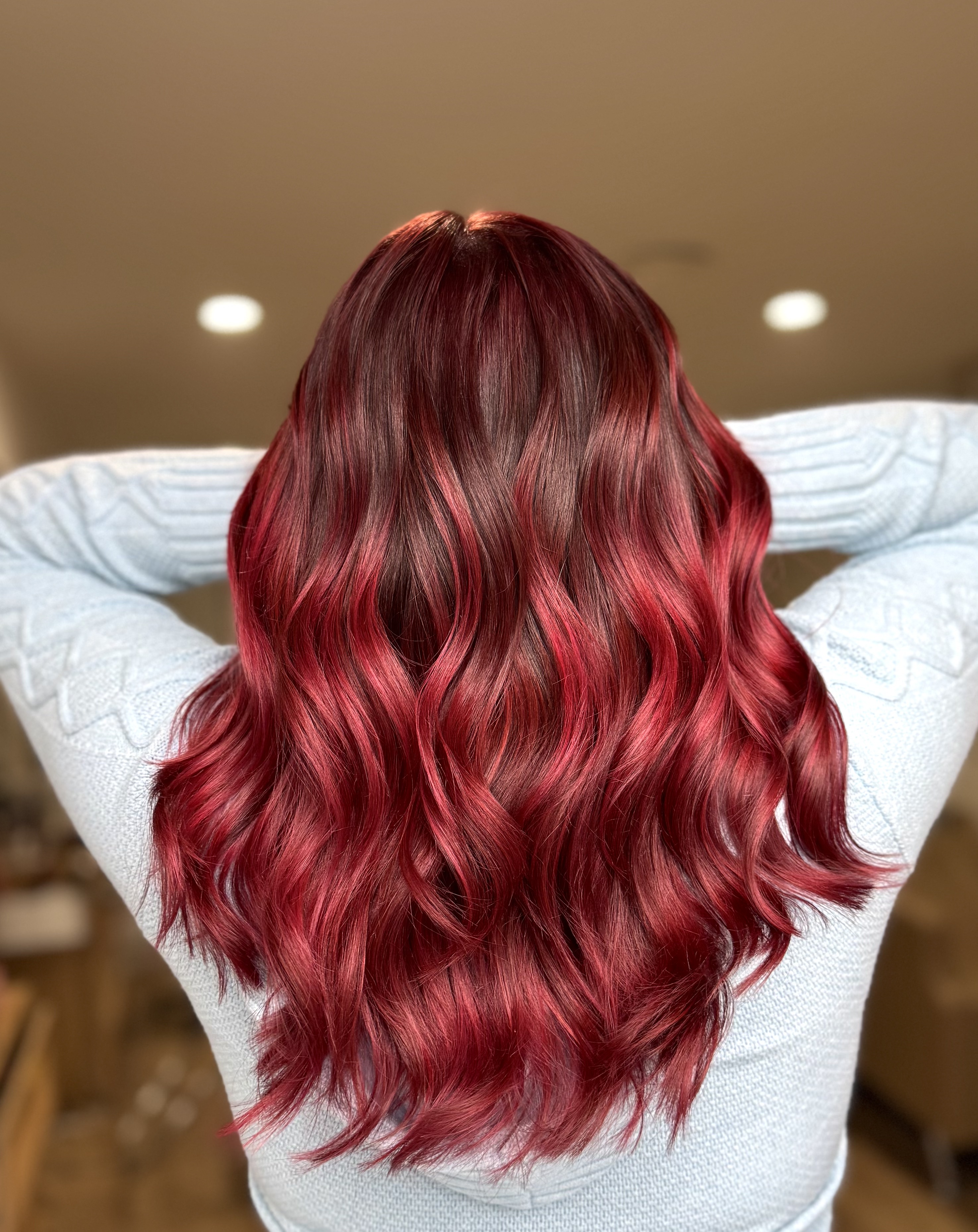 Vibrant red hair color by Veil & Vogue